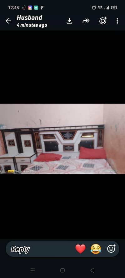Queen size bed with bedside tables.
