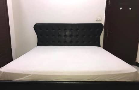 Black king bed, side tables and dressing tables