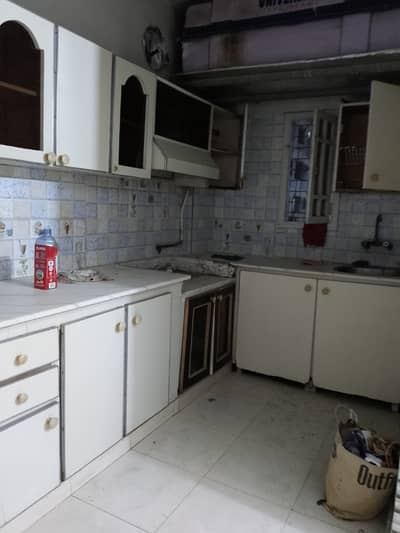 Renovated 2 bed drawing lounge maymar plaza 1st floor flate for rent tiled flooring America kitchen 24 hours water and electricity boundary wall project