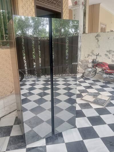 dawlance four door fridge slightly use inverter black color glass door