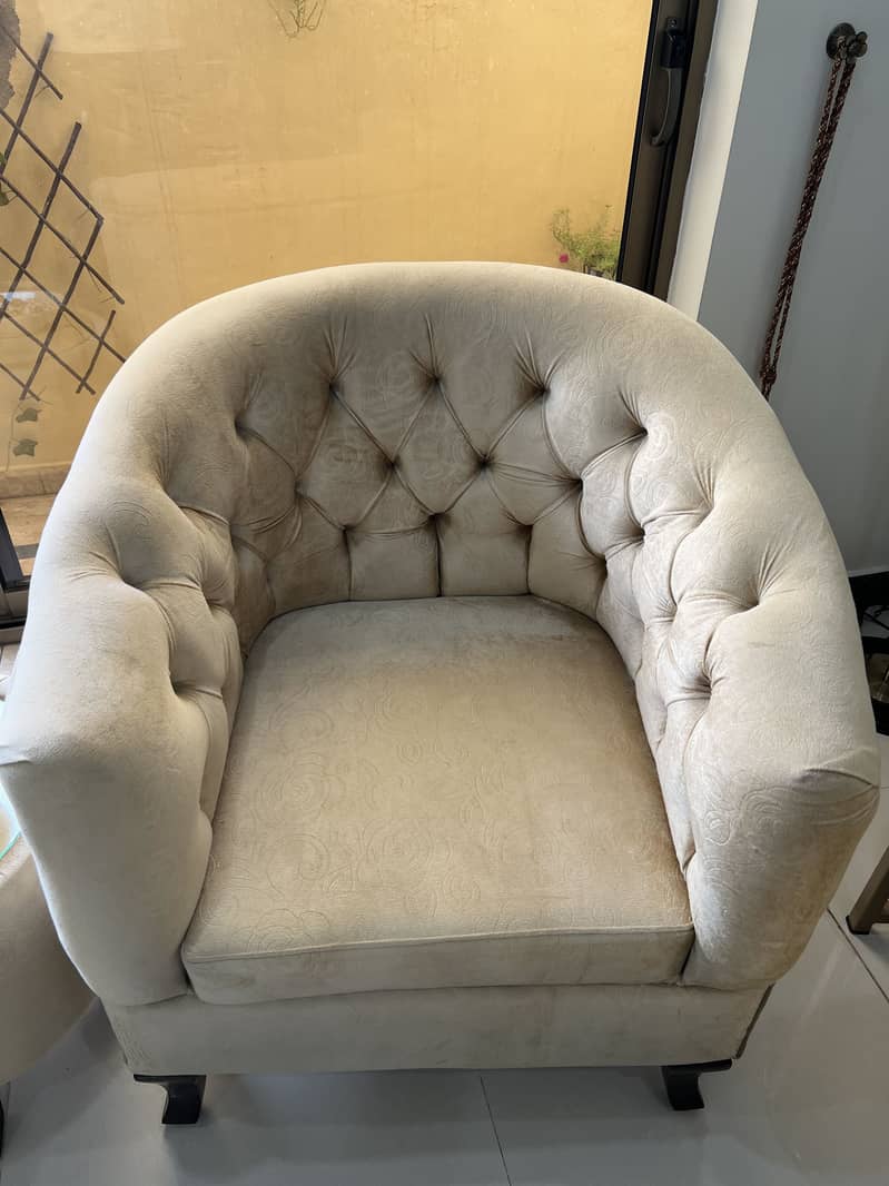 2 single seater comfortable sofa set with table. 1