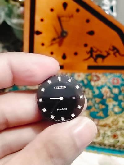 Citizen Eco-Drive watch face featuring diamond accents on a black dial