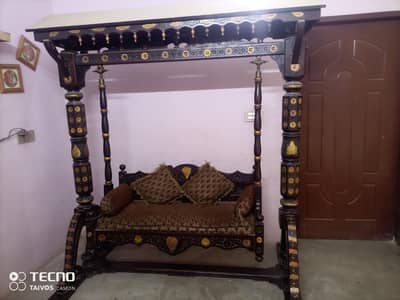 two seated wood swing