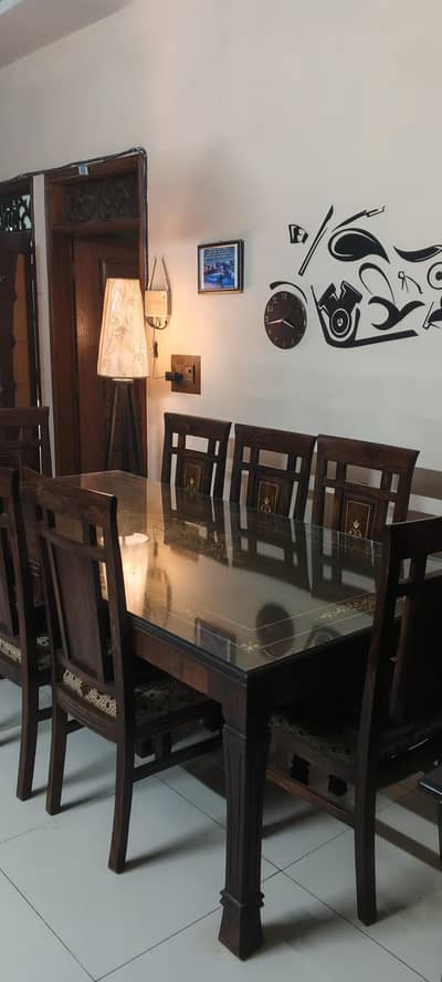 Wooden furnished 8 chair dining table