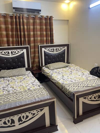 2 single bed and 2 door cubbord