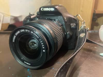 DSLR Camera Canon EoS 550d 18-55mm lens.