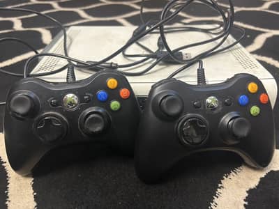 Xbox 360 E 60GB HDD with 2 controllers and 2 games GTA_V  FIFA 17