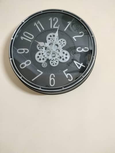 black and silver color wall clock