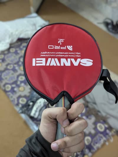 Joola team racket with professional with no damage or dent