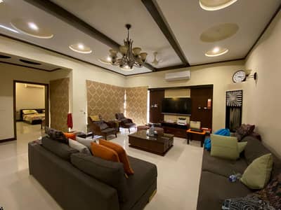 1 KANAL ELEGANT AND FULLY FURNISHED BUNGALOW IS AVAILABLE FOR RENT IN THE BEST BLOCK OF DHA LAHORE.