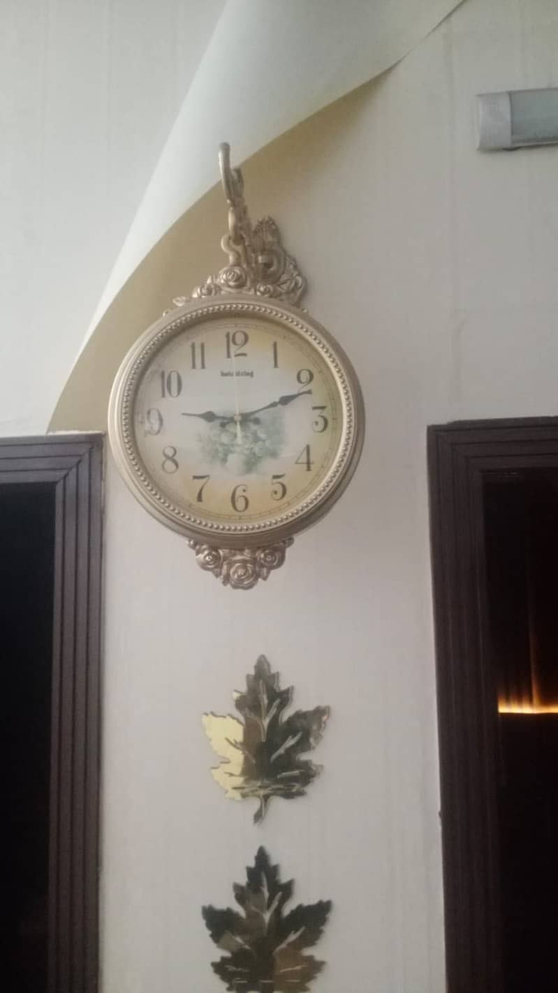Two faced wall clock 1