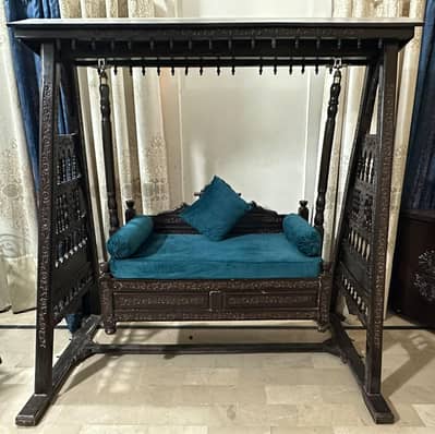 Carved wooden jhula