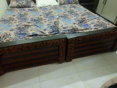 two single bed with huge crown