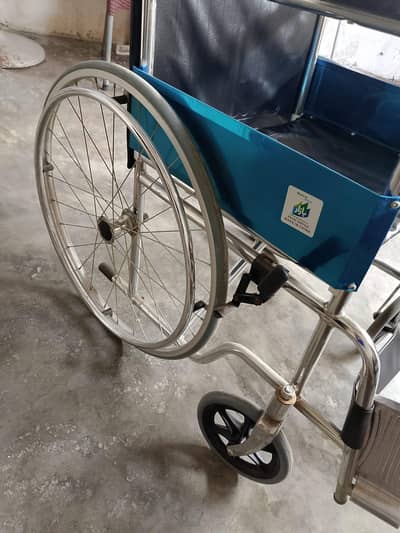 wheelchair totally in new condition with rapper and box