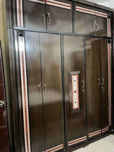 King size bed, 5 door wardrobe, sidetables, and divider.
