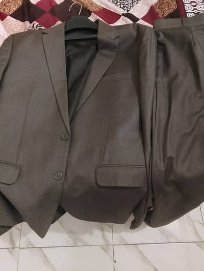 2 Coat pant suits , 3 shirts , tie box and watch available for sale