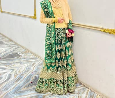 beautiful green lahenga with skin color work
