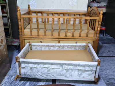 Wooden baby cot with swing cradle
