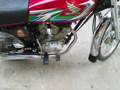 honda 125 23 model Islamabad number lush condition urgent sale