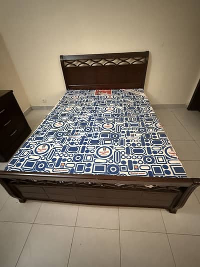 Double wooden bed with mattress