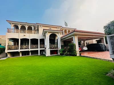 2 Kanal Slightly Used Spanish Design Most Beautiful 9-Bedroom Full Basement Triple Unit Facing Park Bungalow For Sale At Prime Location Of DHA Lahore Near To Park Masjid & Commercial Market .