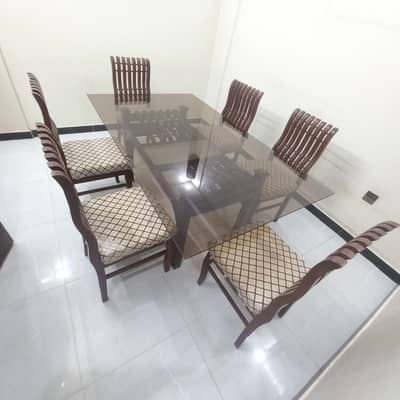 Glass top dining table with 6 chairs