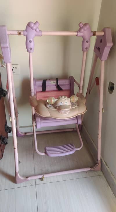 Baby Indoor swing with safety belt and toy - Good Condition