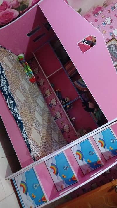 pink doll house with storage
