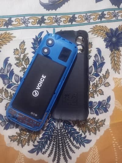 voice mobile phone with charger and box slightly usedl