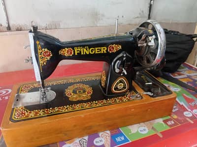 i am selling my gold finger sewing machine  just like brand new