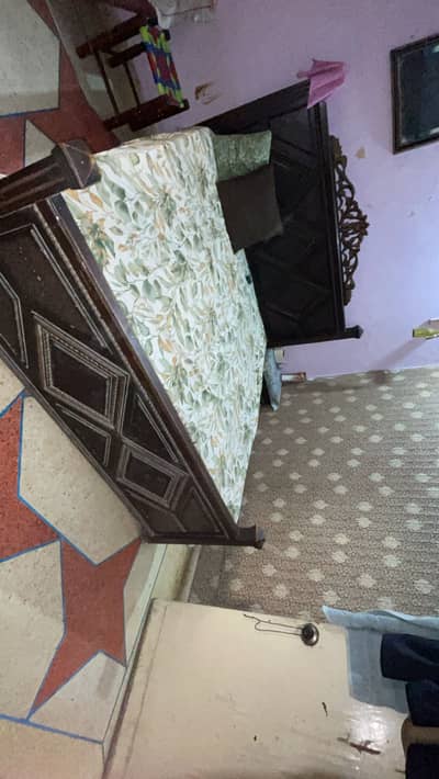 Wooden bed and mattress