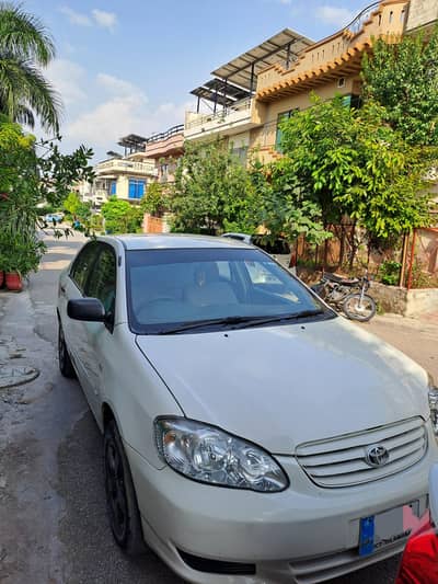 Toyota Corolla 2. OD 2004 Model Islamabad Registered white color