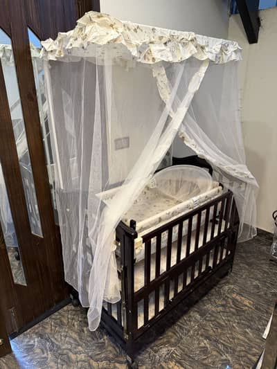 Brand New Wooden Baby Cot/Crib with swing wheels mosquito net