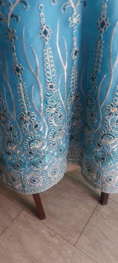 Blue fancy fully embroidered suit on organza stuff.
