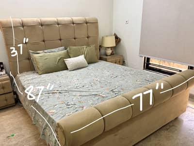 King size luxury upholstered bed with side tables with glass tops