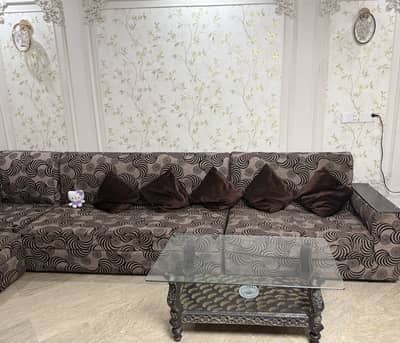 urgent L shape 12 seater sofa with two tables for sale
