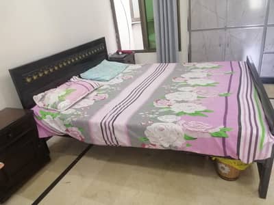 iron bed with side tables and mattress