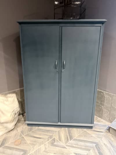 Cupboard of wood is for sale in modern colour