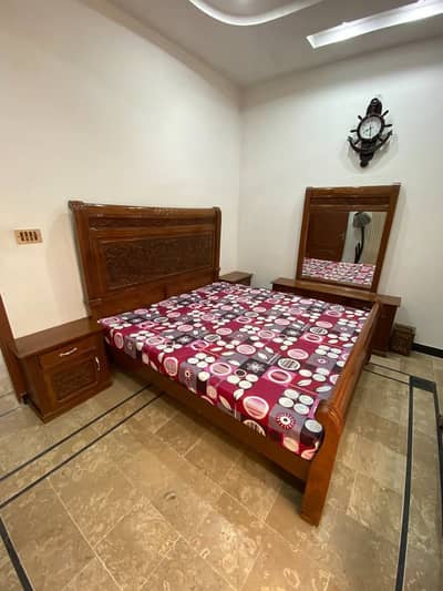 Queen size double bed along with 2 side tables, mattress and dresser
