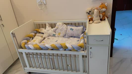 Baby cot/crib with changing station