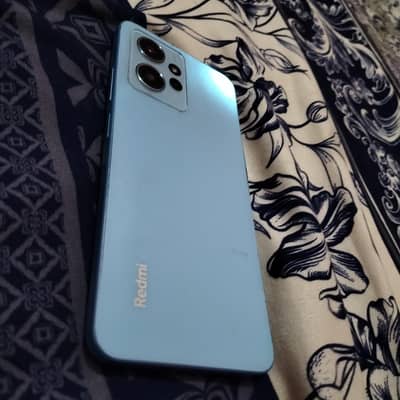 Xiaomi Redmi Note 12 box with charger
