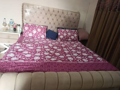 king bed with side tables and dreesing