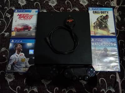 PlayStation 4 slim edition with 4 cds