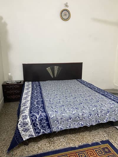 Wooden bed with metres