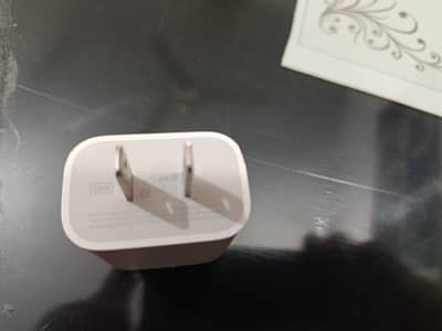 20 w iPhone 12 original charger with cable.