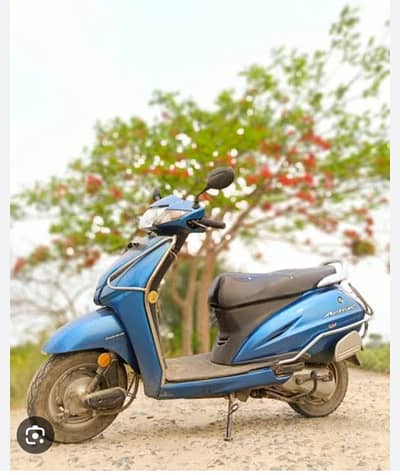 Grey Dio petrol scooty