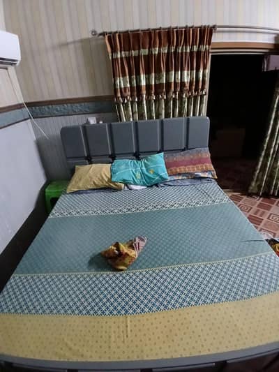 wooden bed with matress in good condition