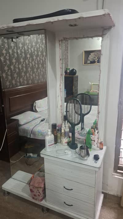 white sheeted wardrobe with built in yellow dim lights