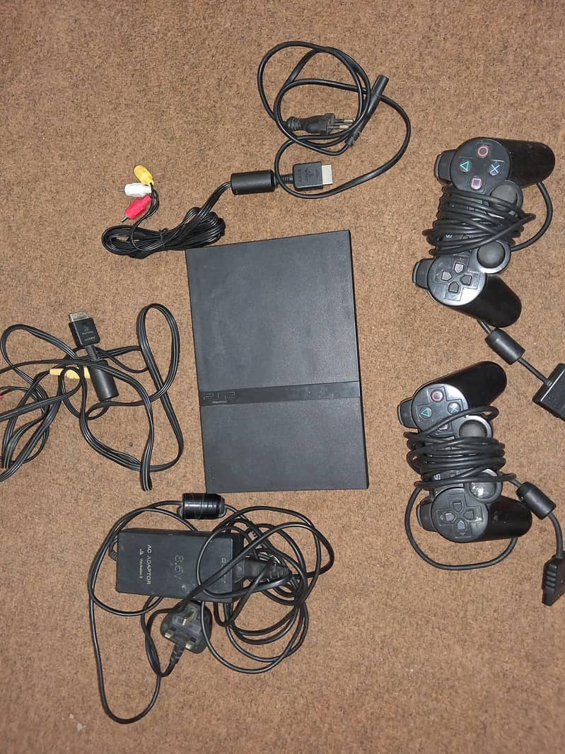 PlayStation 2 + 2 Controllers 7
