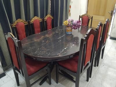 8seater heavy wooden dinning with lamination sheet on top of the table